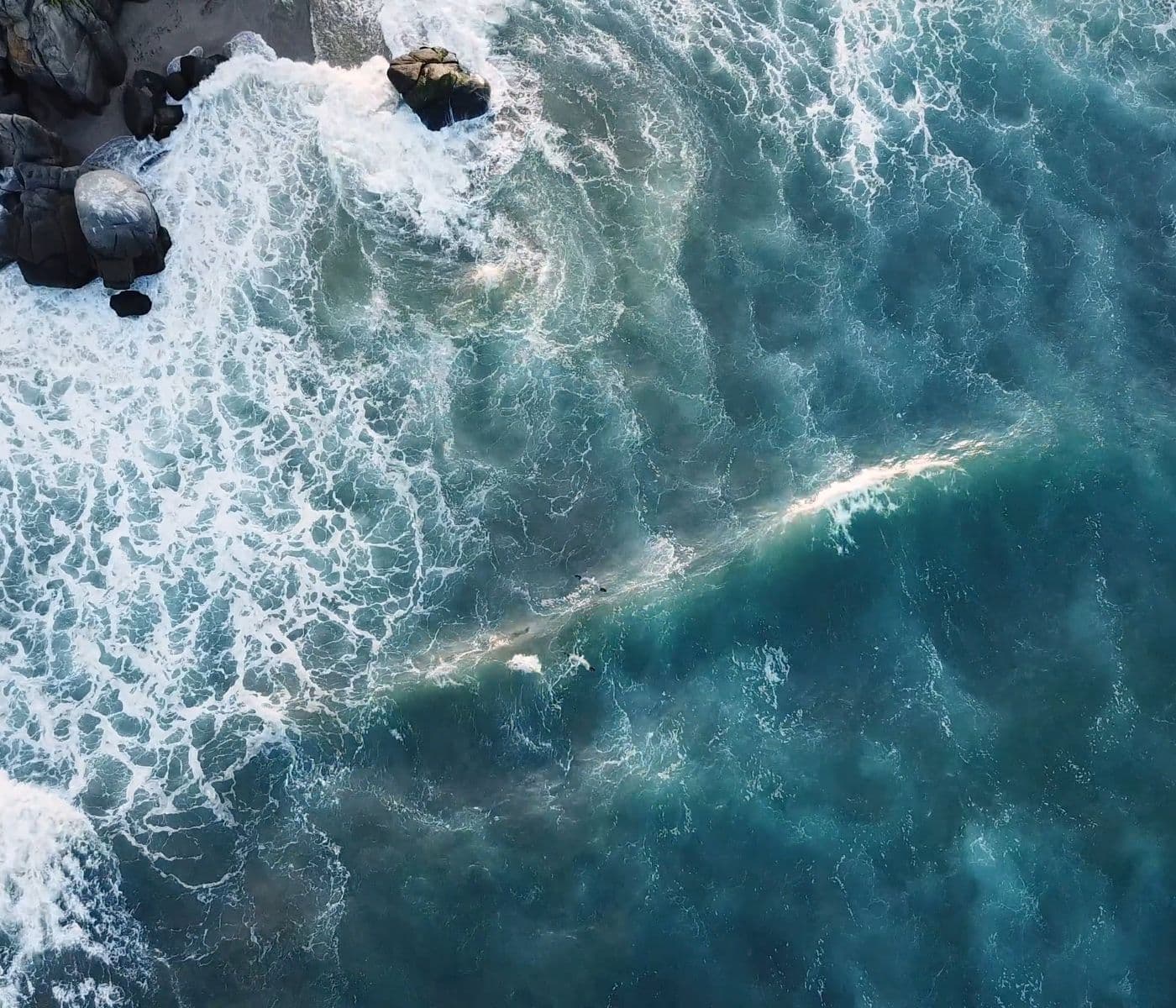 Ocean waves meeting a rocky coastline